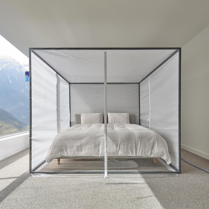 Sleep Cloud altitude tent over a bed